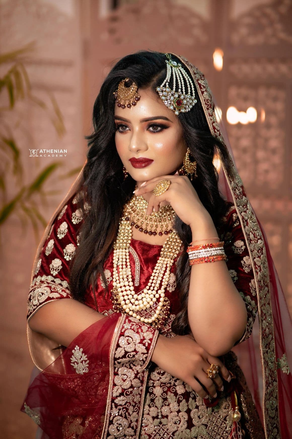 Bridal portrait in maroon and gold